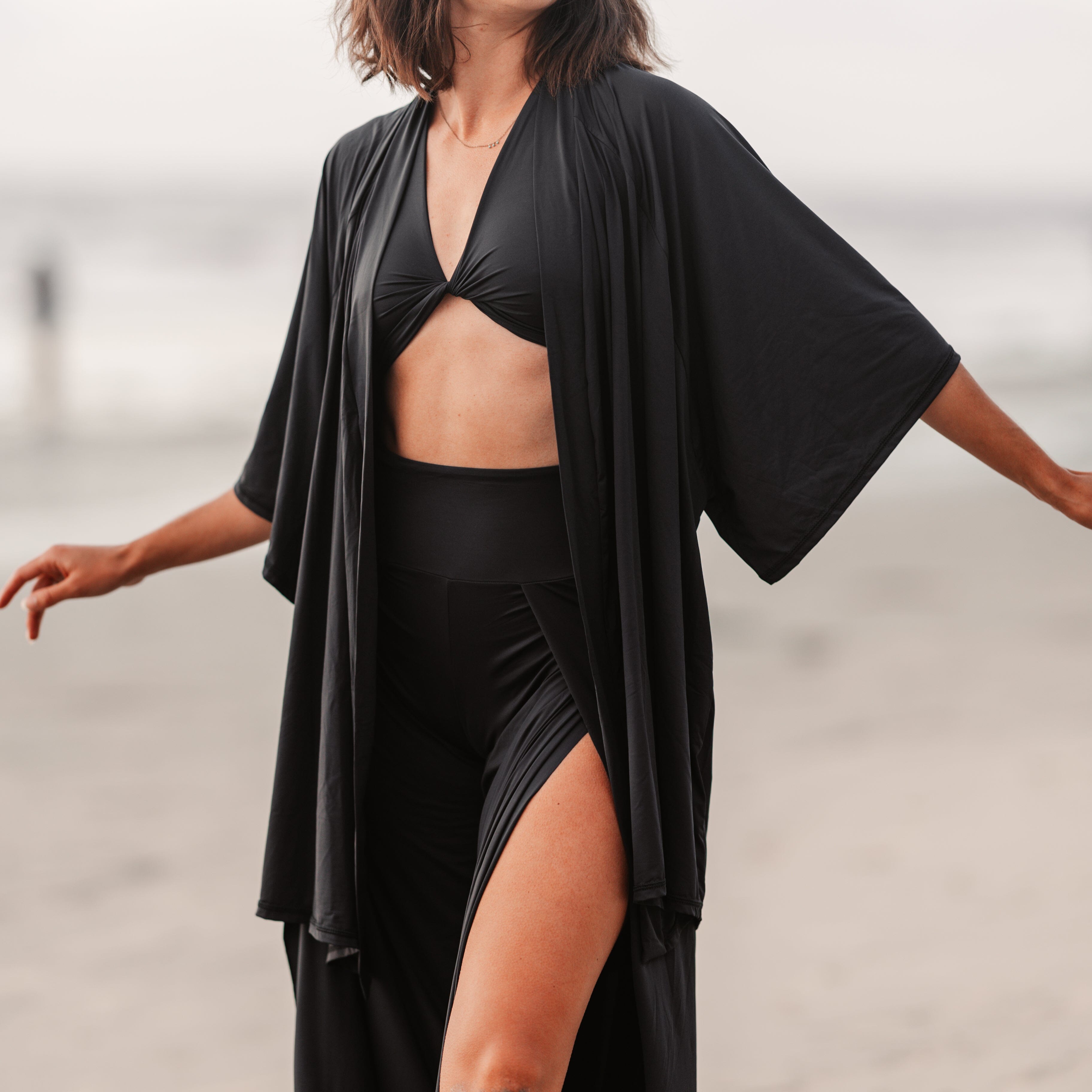 women wearing lounge top, robe and slit pants at beach
