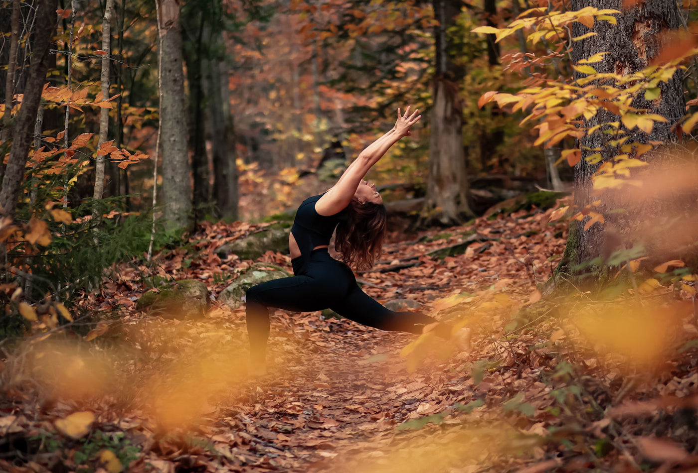 Model in the forest wearing Stevie Bodysuit