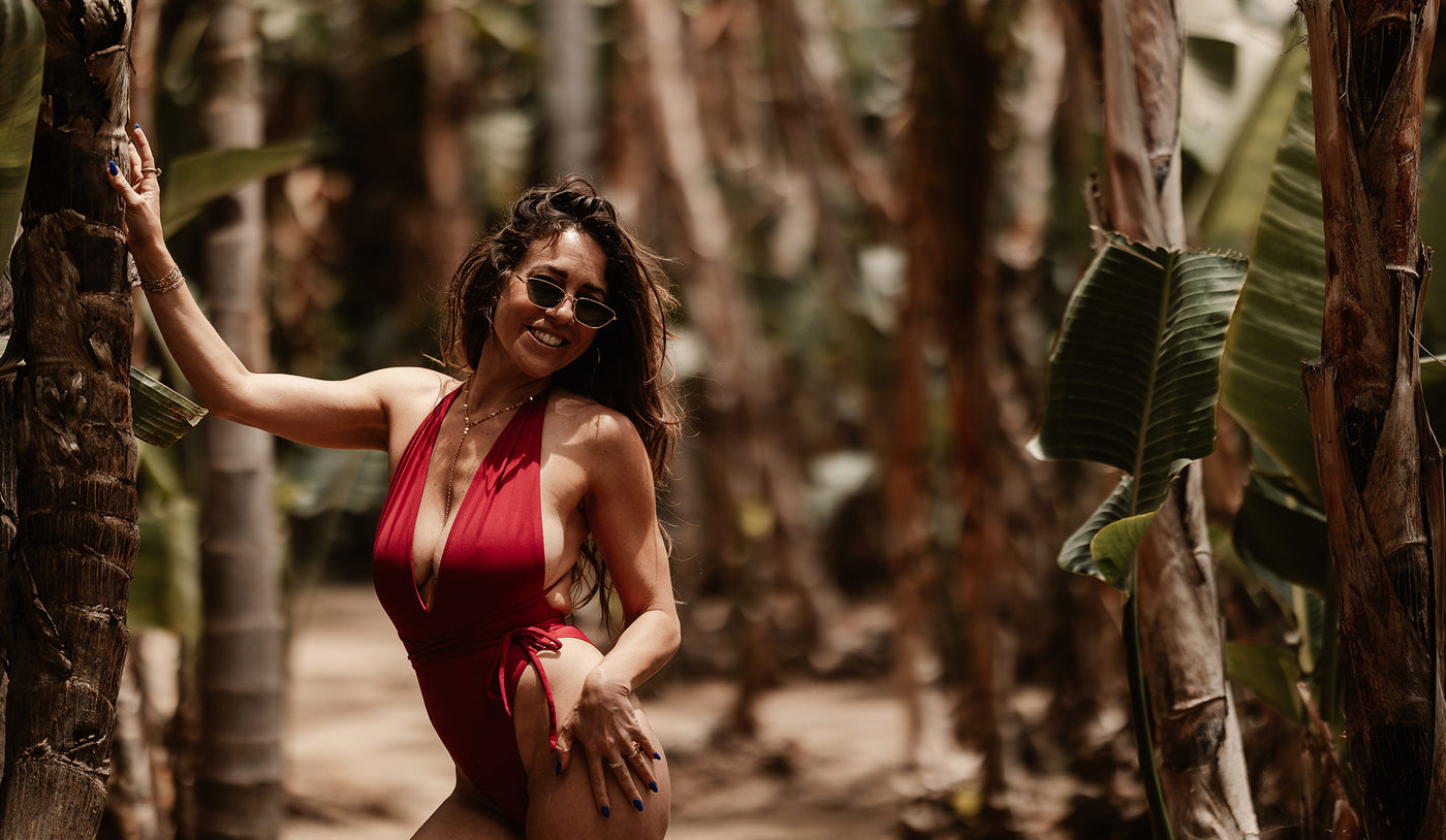 person wearing swimwear surrounded by trees